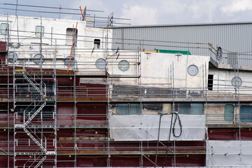 New ferry in construction using crane and scaffolding at Port Glasgow