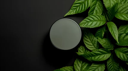 Fotobehang jar with cosmetic product on dark green background made of green leaves mockup © Е К