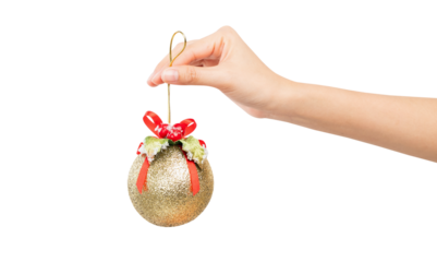 Hand holding gold Christmas ball on isolated background.