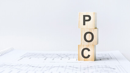 text POC - Proof of Concept - acronym concept on cubes and diagrams on a gray background. business...
