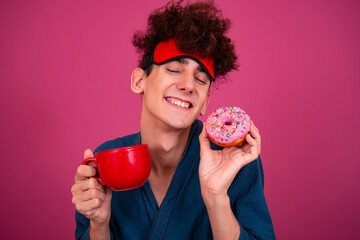 Retro style. A funny curly guy gets ready for his work day early in the morning. Pink background.