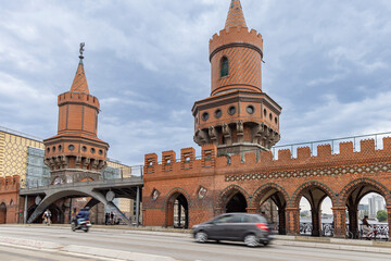 Street view of famous Oberbaum bridge in Berlin Germany during rainy weather. One the main...