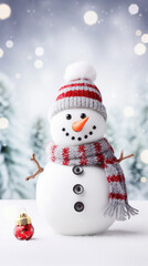 Happy snowman in winter scenery. Close-up shot, winter bokeh background.