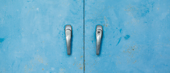 blue metal locker along  in a typical High School.