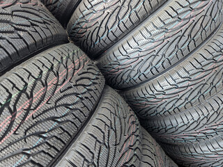 Car tires. Car tire warehouse. Shelf with new car tires