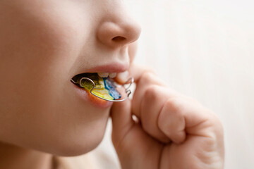 Dental plate Retainer in Child Mouth. Expansion of the Jaw in Child. Happy Girl Kid holding an...