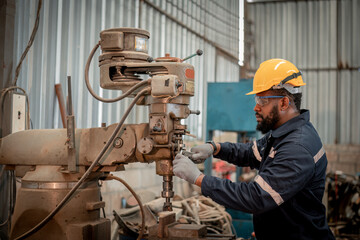 Engineer factory industry wearing safety uniform work and checking system of the welding robots for welding steel electrical by control system robot automate for industry manufacture concept.