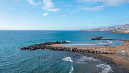 Aerial photo from drone to de Tenerife and beachs Adeje Playa de las Americas, Playa Honda,Playa de Troya, Playa de El Bobo.In the background Tenerife at sunset. Tenerife, Canary islands, Spain