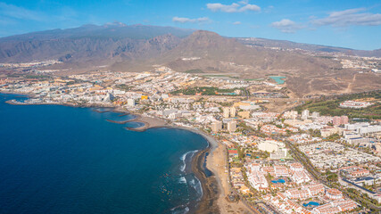 Aerial photo from drone to de Tenerife and beachs Adeje Playa de las Americas, Playa Honda,Playa de Troya, Playa de El Bobo.In the background Tenerife at sunset. Tenerife, Canary islands, Spain