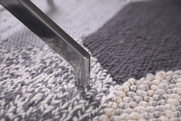 Modern office chair on carpet, closeup view