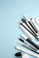 Flat lay composition with different school stationery on light blue background, space for text. Back to school