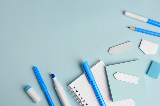 Different school stationery on light blue background, flat lay with space for text. Back to school