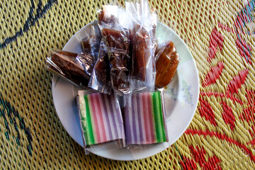 Traditional snack from Indonesia called kue lapis and jenang. Sweet, sticky and chewy texture. On a...