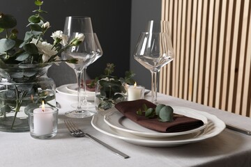 Beautiful table setting with floral decor indoors