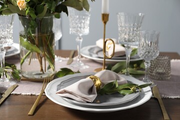 Beautiful table setting with floral decor indoors