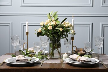 Beautiful table setting with floral decor indoors