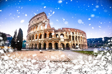 Colosseum of Rome dawn snow view, famous landmark of eternal city winter view