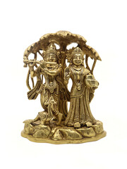 Fototapeta premium radha krishna under a tree bronze idol from an antique collection isolated in a white background 