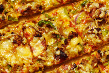 Homemade St. Louis Style Pepperoni Pizza. The tavern cut, close up