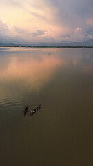 aerial view of a fisherman on his boat in the lake