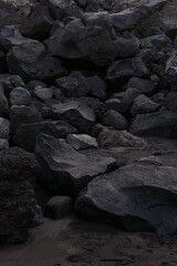 black rocks on the beach - obrazy, fototapety, plakaty
