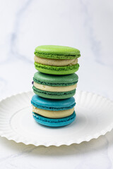 Handmade macaroons on a white background, close up