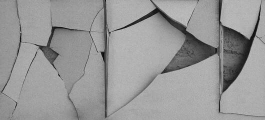Cracked tile. Broken tile on the wall. An old, chipped, grey white tiled wall. Broken cracked...