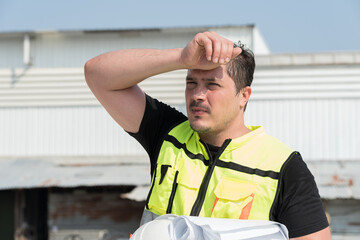 Foreman construction builder tired and thirst of water at construction site