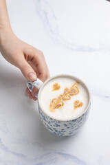 Coffee in a light cup, close up