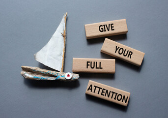 Give your full Attention symbol. Concept word Give your full Attention on wooden blocks. Beautiful...
