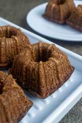 bolu pisang coklat kukus or steamed chocolate banana sponge cake served on a white plate