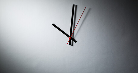Abstract clock - modern clock hands showing time under dramatic light - 691055548