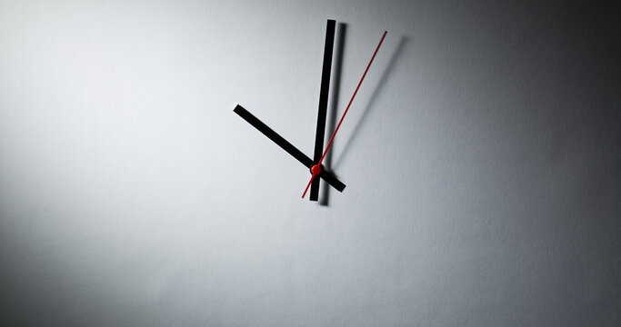 Abstract clock - modern clock hands showing time under dramatic light