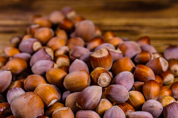 Pile of the hazelnuts on wooden table