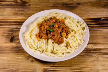 Pasta with bolognese sauce in a ceramic plate