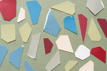 grungy paper shapes on rough green paper