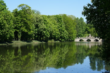 Fototapeta na wymiar Stony bridge in baths park in European Warsaw city in Poland
