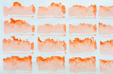 array of gradient orange stains on blank paper