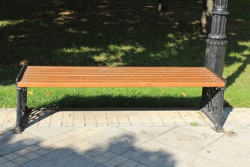 A new bench for relaxing in the park. Russia.