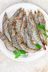 shrimp raw prawn seafood fresh eating cooking appetizer meal food snack on the table copy space food background rustic top view Pescetarian