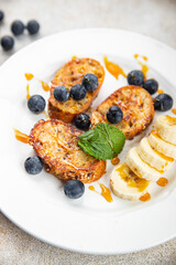 sweet breakfast French toast berrie, banana pancake fresh cooking meal food snack on the table copy space food background rustic top view