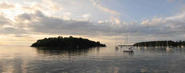 Panoramic view of sailboats at anchor in a bay of Lake Champlain