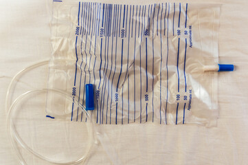 Yellow latex Foley catheter and urine drainage bag collect urine for disability or patient.