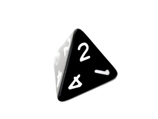 A black D4 four sided dice isolated on white. RPG dice. tetrahedron DND dice