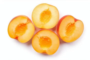 Fotobehang Some peaches that cut to half isolated on white background, halves of nectarines, juicy slices of peach, sliced chopped nectars, core removed, generated by AI. © MeSSrro