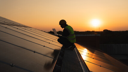 Service engineer checking solar cell on the roof for maintenance if there is a damaged part....