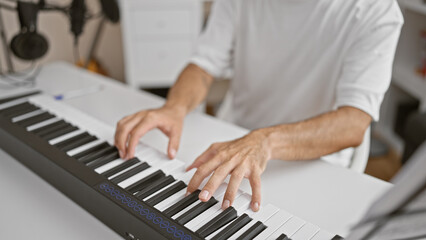 Artistic man's hands strum passionate melody on acoustic piano. soulful musician lighting up the indoor music studio with his musical prowess