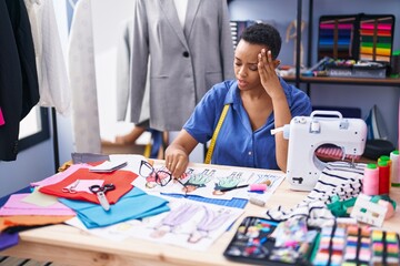 Fototapeta premium African american woman tailor stressed working at tailor shop