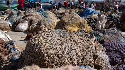 Bundles of fishing nets on the quay at the harbor in Essaouira, Morocco