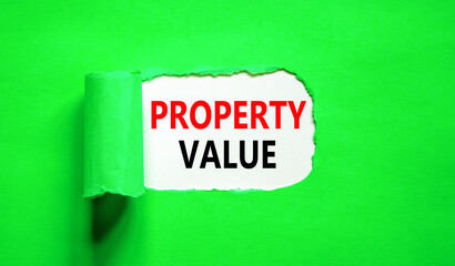 Property value symbol. Concept words Property value on beautiful white paper. Beautiful green paper background. Business property value concept. Copy space.